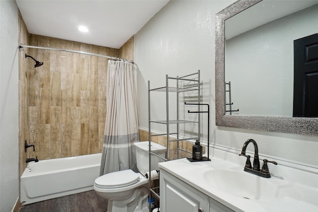 full bathroom with shower / bath combination with curtain, vanity, wood-type flooring, and toilet