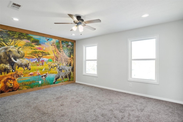 unfurnished room featuring carpet flooring and ceiling fan