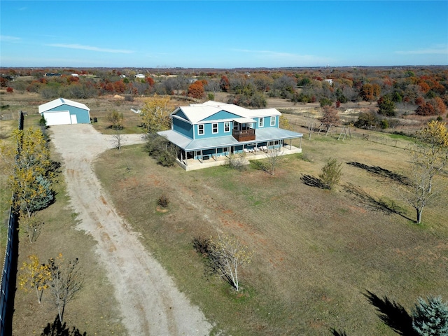 birds eye view of property featuring a rural view