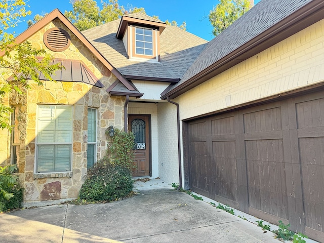 property entrance with a garage