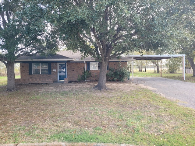 ranch-style home with a carport