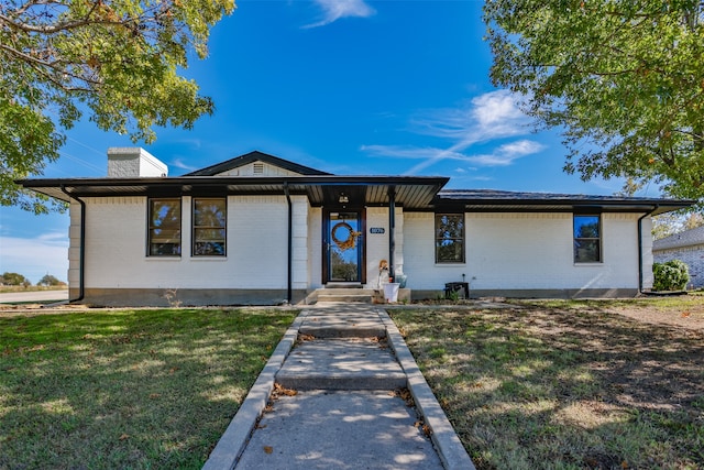 view of front of home with a front yard