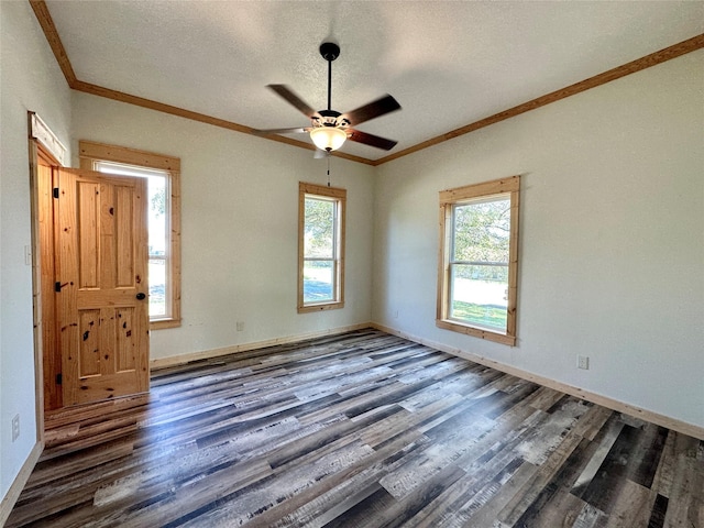 unfurnished room with dark hardwood / wood-style floors, ceiling fan, ornamental molding, and a textured ceiling