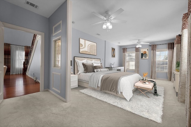 carpeted bedroom featuring ceiling fan