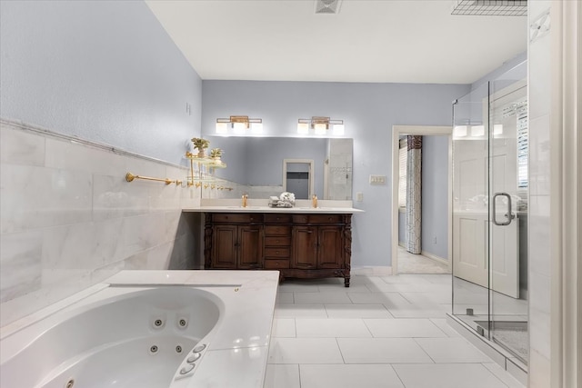 bathroom featuring tile patterned floors, vanity, and plus walk in shower