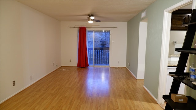 unfurnished room featuring ceiling fan and light hardwood / wood-style flooring