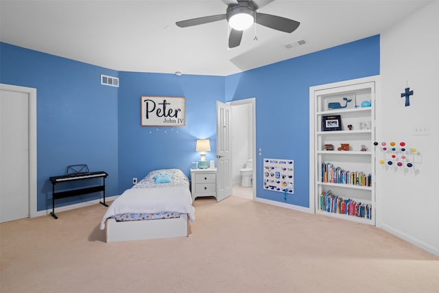 carpeted bedroom featuring ensuite bathroom and ceiling fan