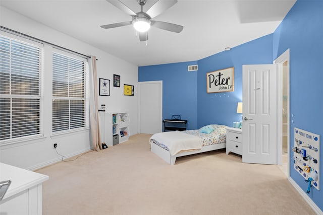 carpeted bedroom with ceiling fan