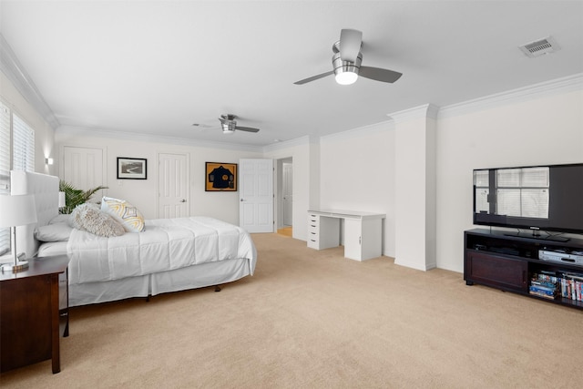 carpeted bedroom with ceiling fan and crown molding