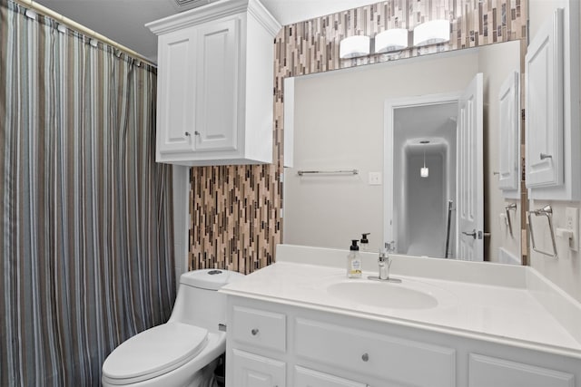 bathroom featuring vanity, toilet, and a shower with shower curtain