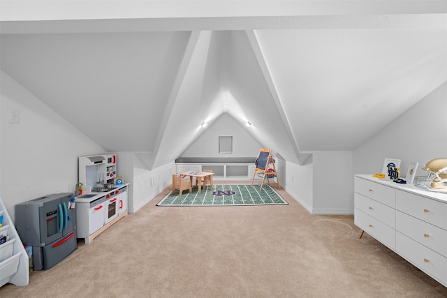 recreation room with light colored carpet and vaulted ceiling