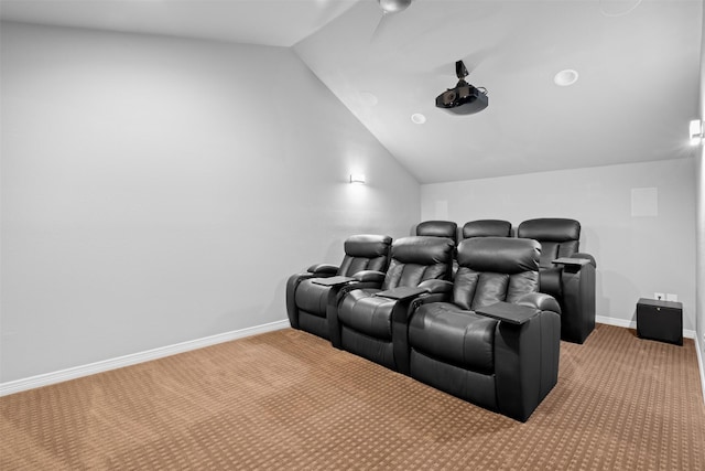 cinema featuring carpet and vaulted ceiling