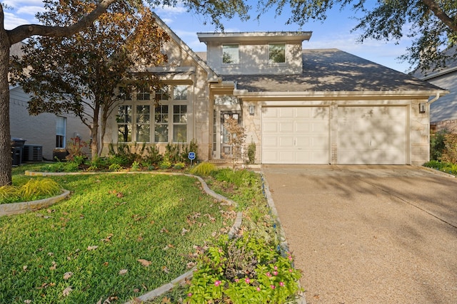 view of front facade with a front yard and a garage