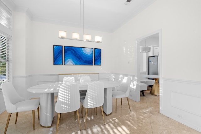 dining space featuring ornamental molding