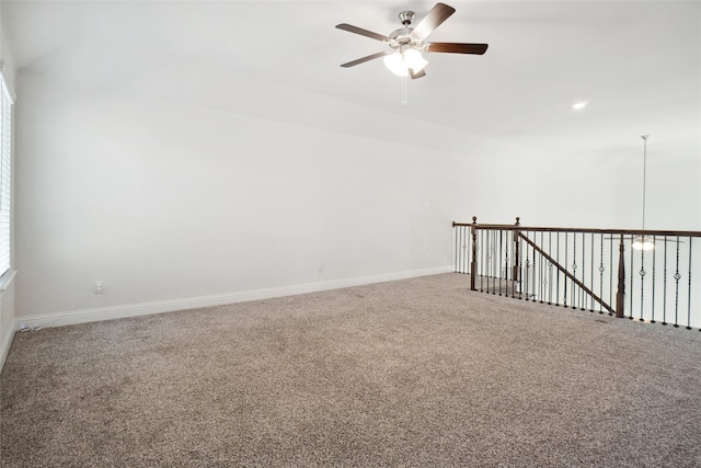 empty room featuring carpet and ceiling fan