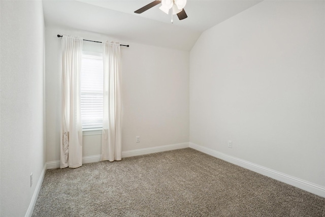 carpeted empty room with vaulted ceiling and ceiling fan