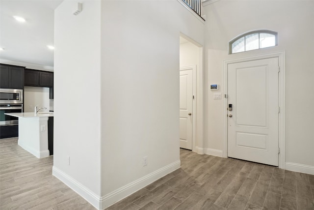 foyer with light hardwood / wood-style flooring