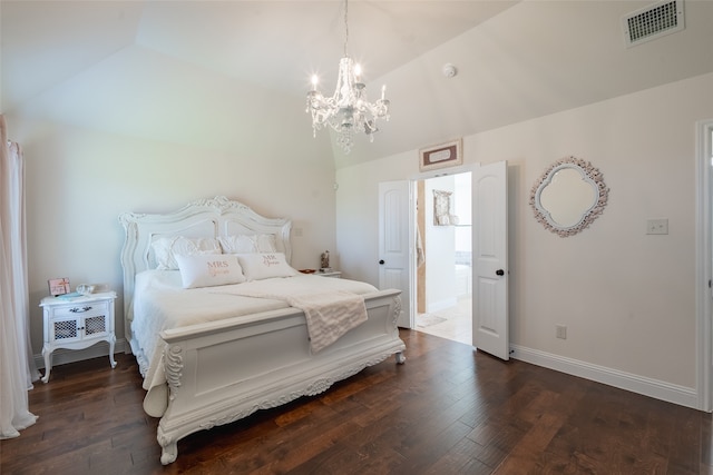 bedroom with dark wood-type flooring, a chandelier, and vaulted ceiling