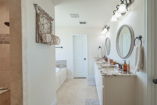 bathroom featuring independent shower and bath, vanity, and tile patterned floors