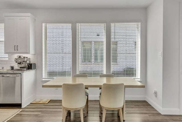 dining area with plenty of natural light and light hardwood / wood-style floors