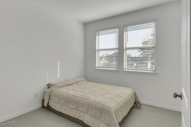 bedroom with light colored carpet