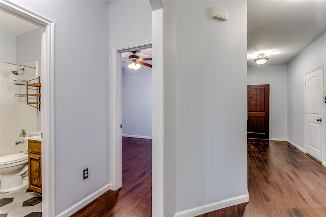 hallway featuring dark hardwood / wood-style floors