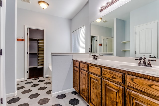 bathroom featuring vanity and plus walk in shower