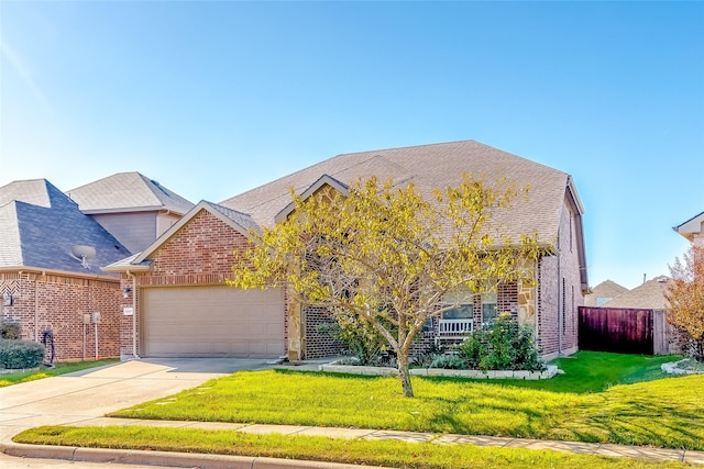 view of front of house featuring a garage and a front yard