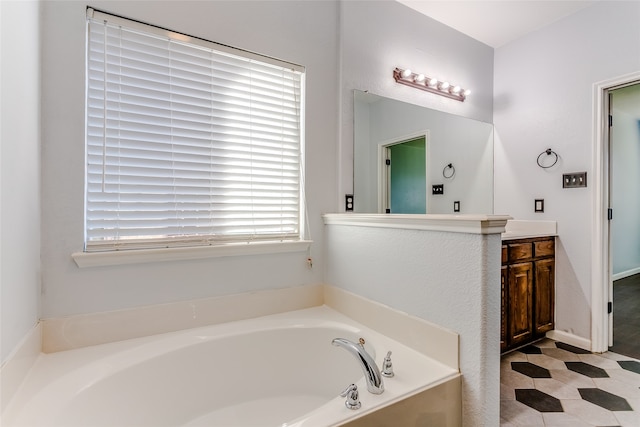 bathroom with vanity and a bath