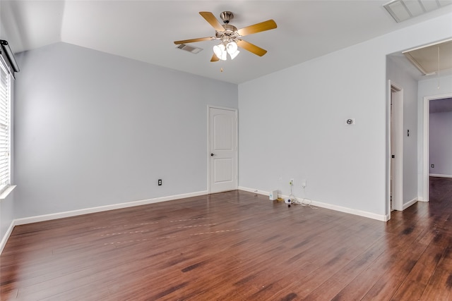 empty room featuring dark hardwood / wood-style flooring, ceiling fan, and lofted ceiling