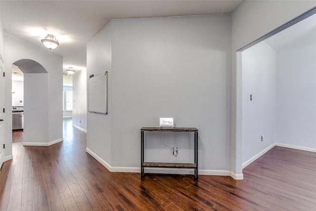 hall with dark hardwood / wood-style floors