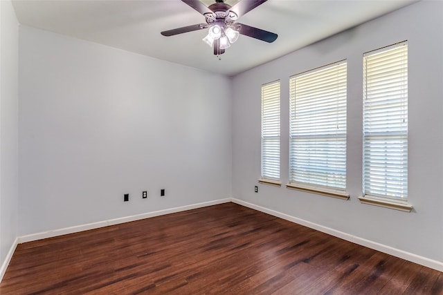 unfurnished room featuring dark hardwood / wood-style flooring and ceiling fan