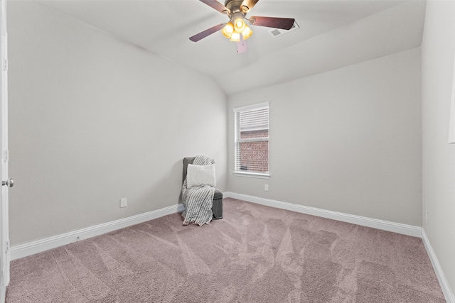 unfurnished room with ceiling fan, lofted ceiling, and light carpet