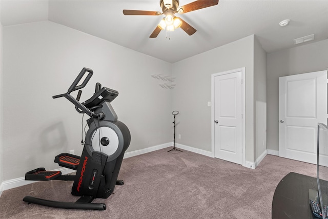 workout room featuring light carpet, vaulted ceiling, and ceiling fan