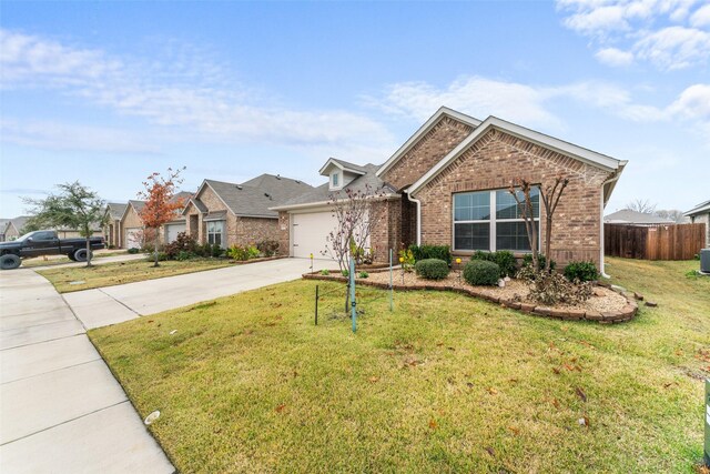 view of front of property with a front lawn and a garage