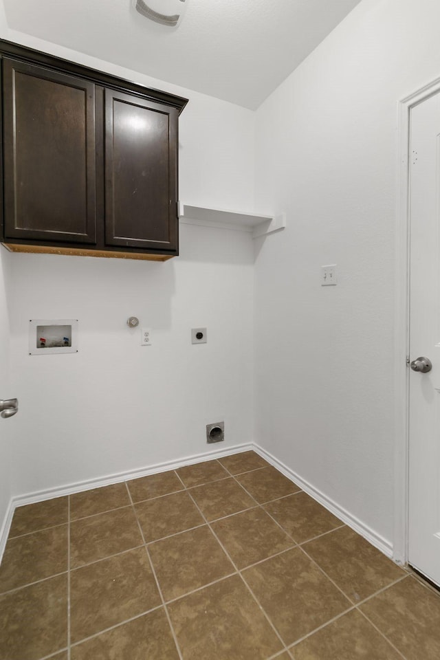 washroom featuring hookup for a washing machine, dark tile patterned floors, hookup for an electric dryer, and hookup for a gas dryer