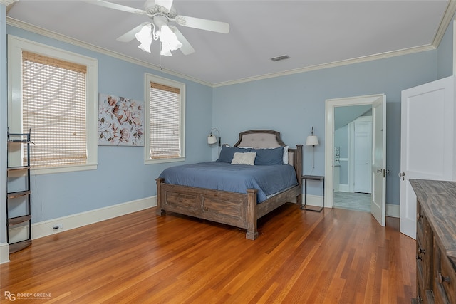 bedroom with hardwood / wood-style flooring, ceiling fan, and crown molding