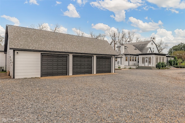 view of front of home featuring an outdoor structure and a garage