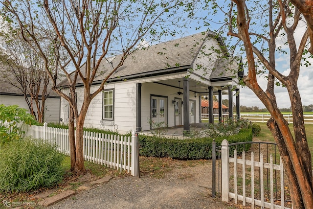 view of front of home featuring ceiling fan and covered porch