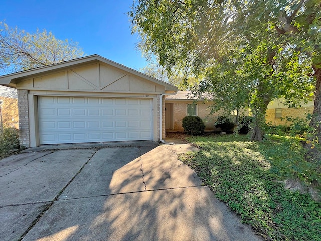 single story home featuring a garage