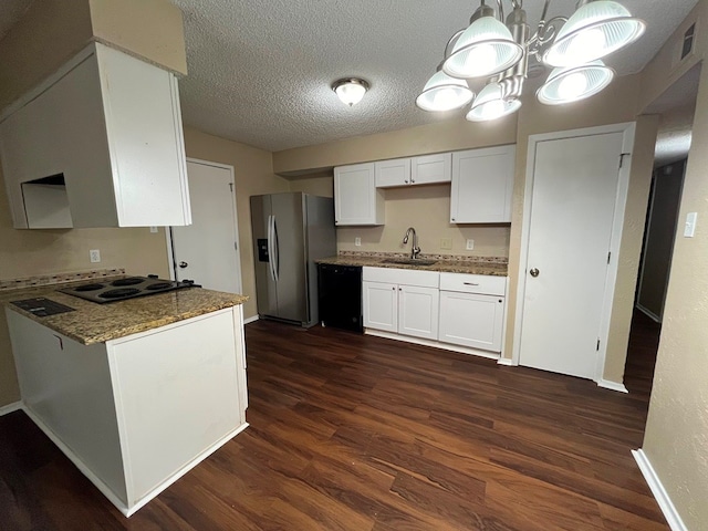 kitchen featuring stainless steel refrigerator with ice dispenser, electric cooktop, dishwasher, dark stone counters, and white cabinets