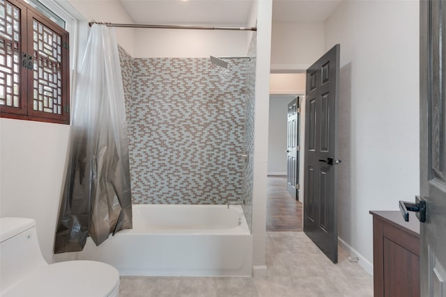 full bathroom featuring vanity, toilet, and shower / tub combo with curtain