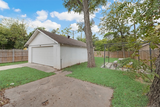 garage with a yard