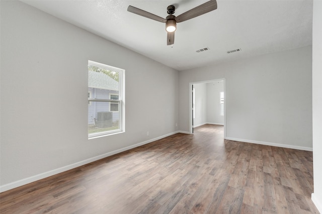 spare room featuring hardwood / wood-style flooring and ceiling fan