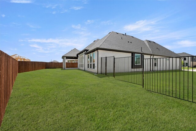 view of yard with a fenced backyard