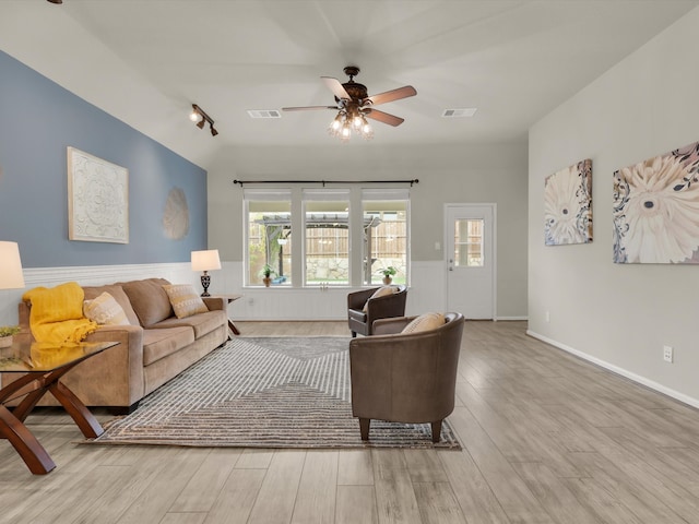 living room featuring ceiling fan and light wood-type flooring