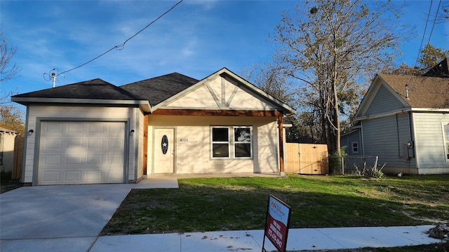 view of front facade with a garage and a front yard