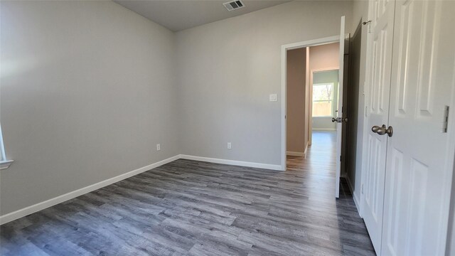 unfurnished room featuring wood-type flooring