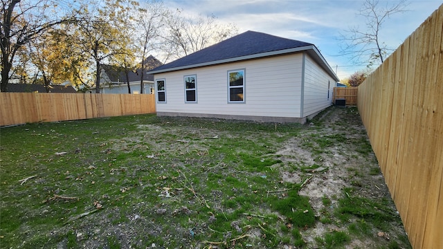 back of property featuring a lawn