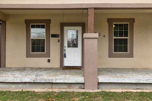 entrance to property featuring covered porch